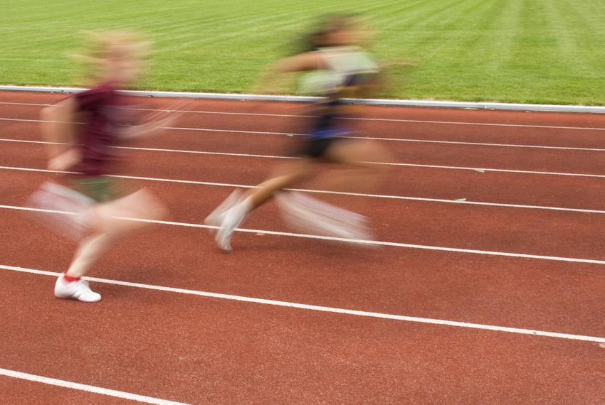 Track athletes at a school track meet.